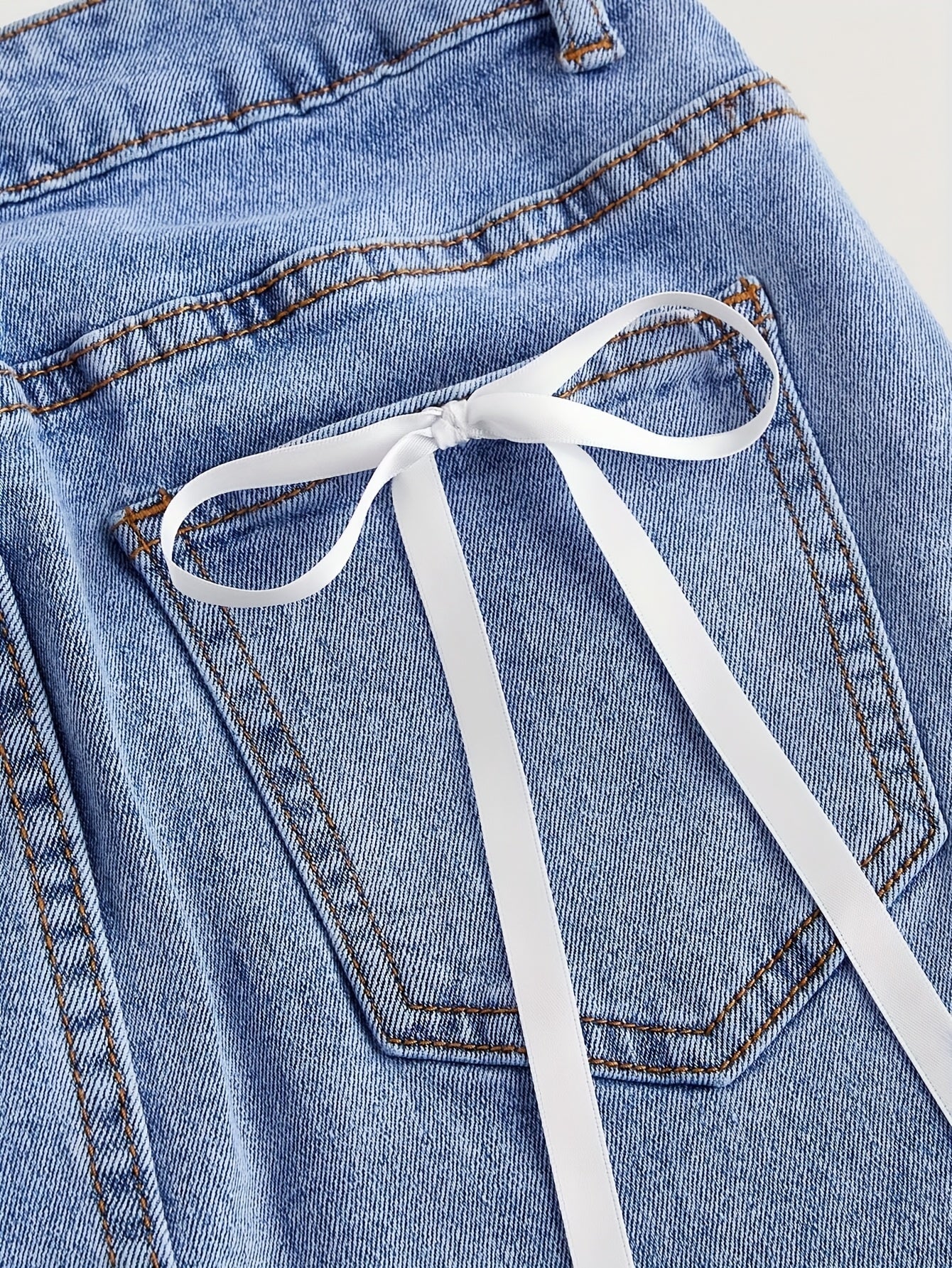 Jupe en jean courte avec nœuds décoratifs pour femme, style élégant et décontracté - Image 4